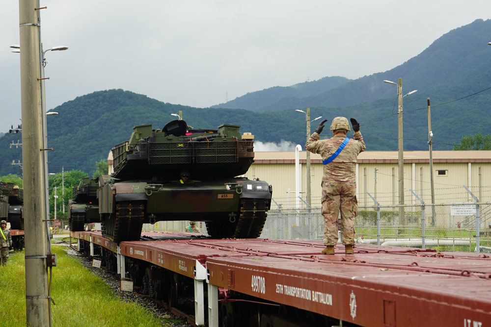 The 25th Transportation Battalion and Transportation division of the U.S. Army Materiel Support Command – Korea supports rail-load operations to bolster rotational units with the 2nd Infantry Division, ROK-US Combined Division at Camp Casey, Korea Aug. 12, 2023. The rail-load operations played a critical role in moving the Army Prepositioned Stock-4 (APS-4) from Camp Carroll to Camp Casey in support of a 1st Armored Division’s “no notice” Deployment Response Exercise. The exercise demonstrated the 1st Armored Division’s ability to rapidly respond to any mission while ensuring their equipment, gear, and personnel ready for deployment. The successful completion of the DRE reaffirmed the Army’s readiness and fight-tonight capabilities on the Korean Peninsula while fulfilling the Army’s commitment to maintain armored readiness. The Army Prepositioned Stock program is a cornerstone of the Army’s ability to rapidly project power and send a clear signal of U.S. commitment to maintaining combat power in the region. (U.S. Army photos by: Staff Sgt. Felix Mena 210 Field Artillery, 2nd Infantry Division, ROK-US Combined Division)