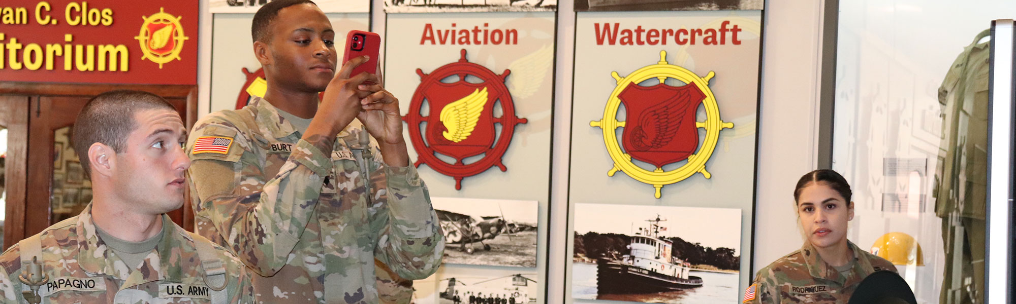 Image of U.S. Army Transportation Soldiers looking at the exhibits within the lobby of the TC Museum.